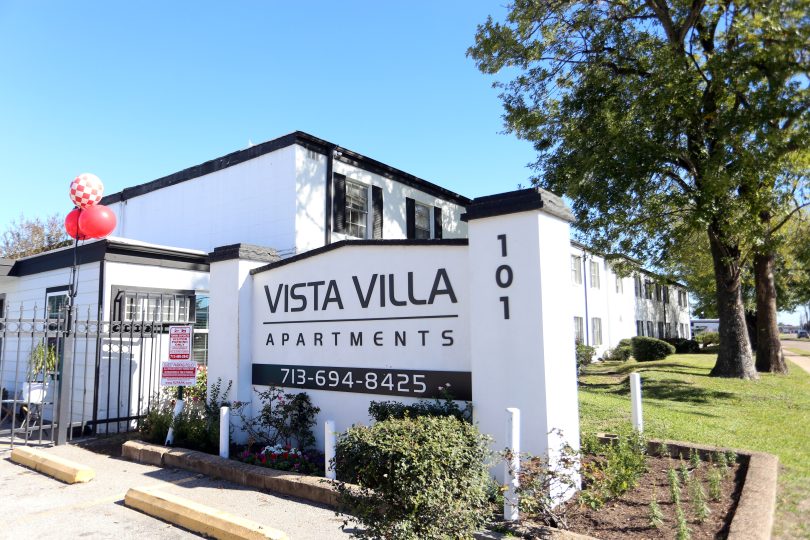 the sign for vista villa apartments is in front of a building at The Vista Villa Apartments